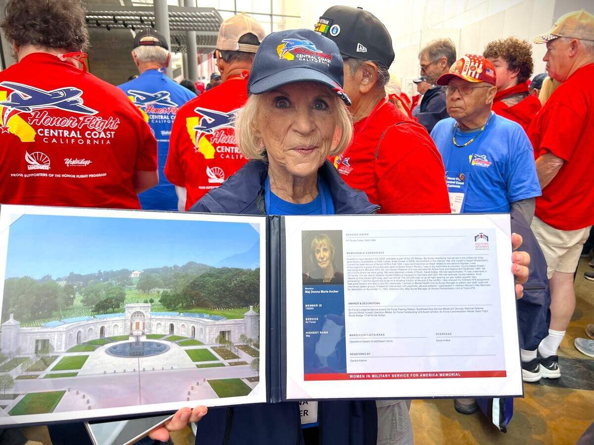 Maj. Donna Marie Archer displays her registry profile from the Military Women’s Memorial during an Honor Flight Central Coast California trip to Washington, D.C. The memorial near Arlington National Cemetery honors women who served in the U.S. military.