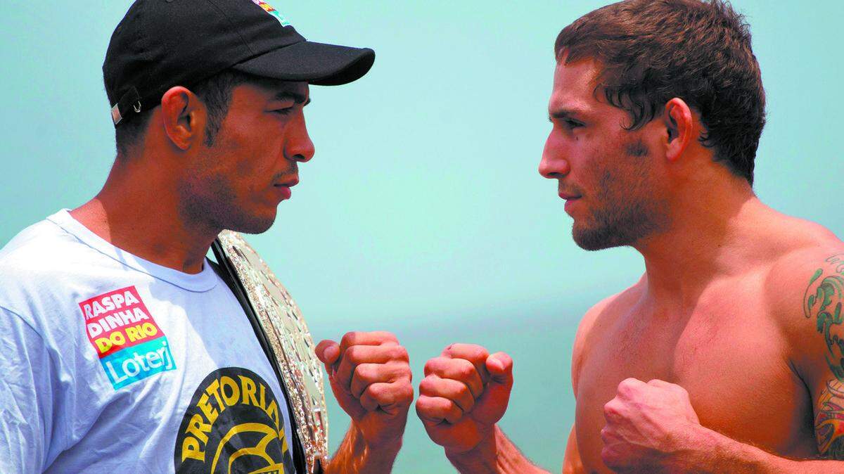José Aldo of Brazil, left, and former Cal Poly wrestler Chad Mendes pose during an Ultimate Fighting Championship Rio Open Workouts event Jan. 11, 2012, at Barra de Tijuca Beach in Rio de Janeiro. Aldo handed Mendes his only loss in professional mixed martial arts with a first-round technical knockout in a UFC featherweight title bout 
Jan. 14, 2012, at UFC 142 in Rio de Janeiro.