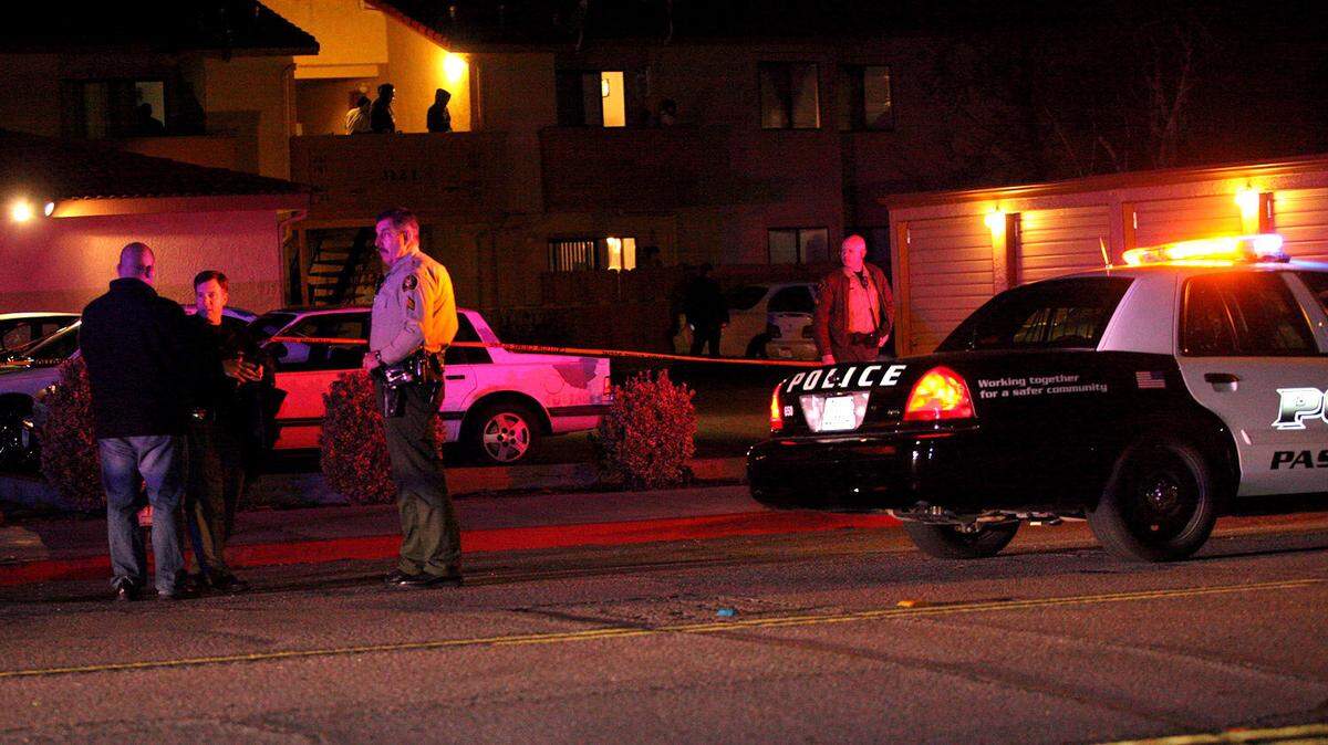 Paso Robles police examine the scene of a shooting Saturday, Feb. 23, on Spring Street.