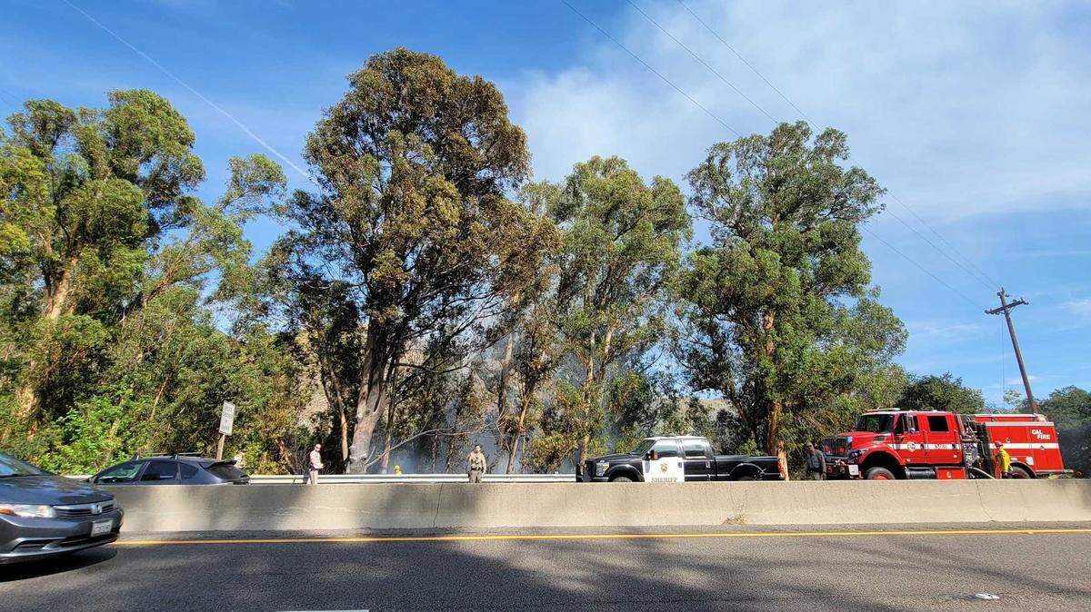 One lane of Highway 101 near the Cuesta Grade is closed following a vehicle collision and fire Friday afternoon. 