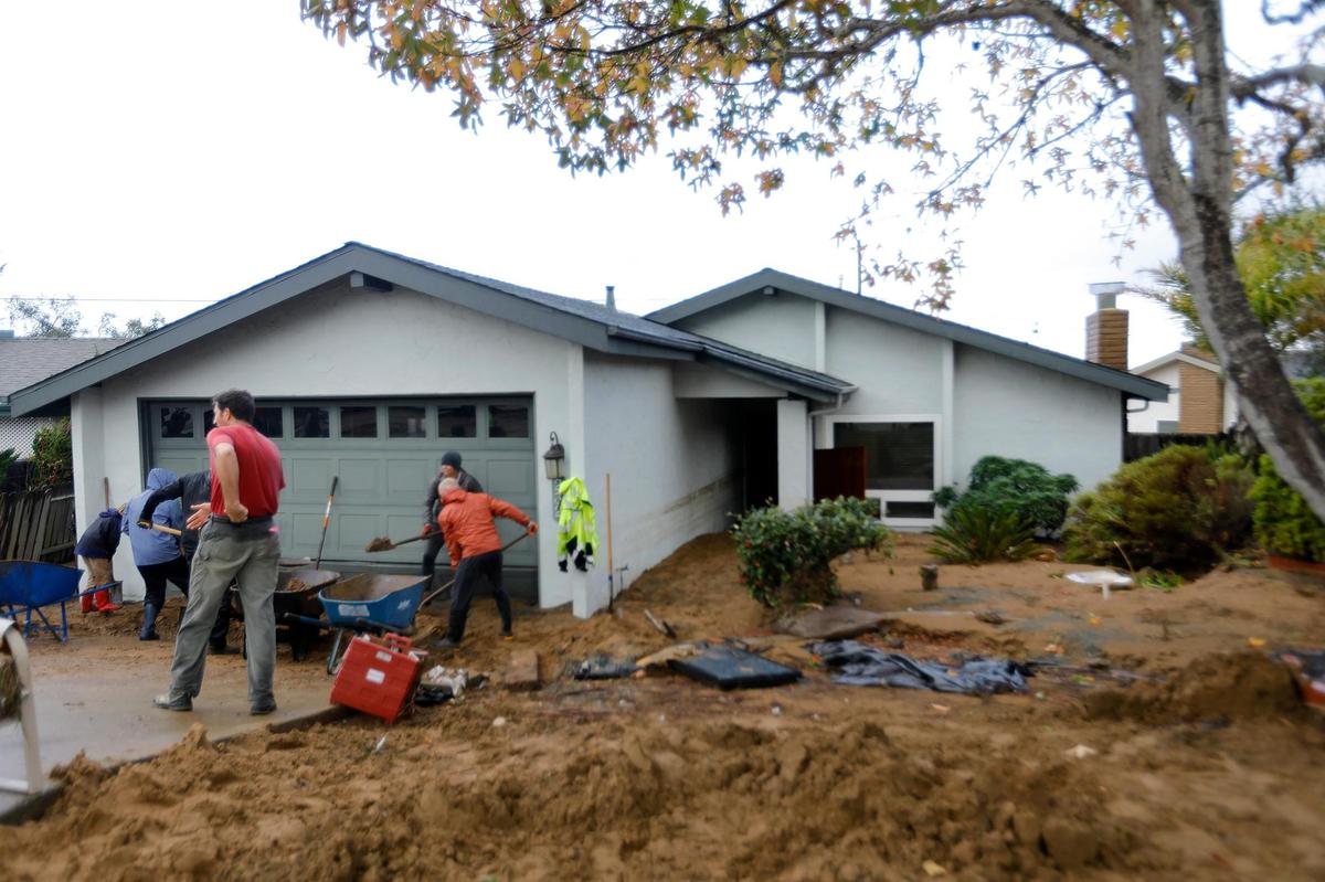 One home on Vista Court suffered the brunt of the floodwaters from a failed water retention basin in Los Osos on Monday, Jan. 9, 2023. The interior, front yard and back yard were inundated with water and mud.