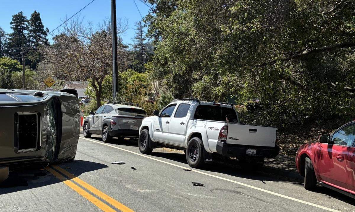 A car flipped on its side after ramming into a parked car at Chorro Street and West Street in San Luis Obispo on March 20, 2026.