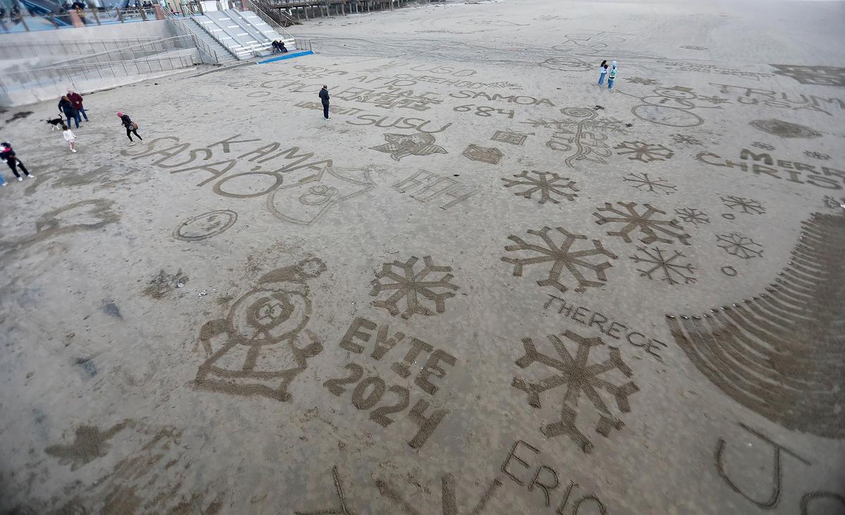 The finished snowflakes. Beachgoers turn Pismo Beach into a seaside winter wonderland at a “Snowflakes on the Sand” event, Saturday, Dec. 14, 2024.