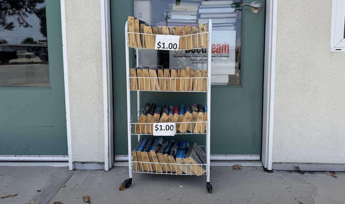 A cart holds $1 books outside A to Z Books in Arroyo Grande.