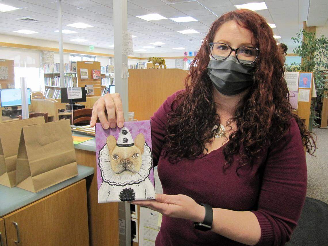 Destiny Johnson, branch manager of the Cambria Public Library, painted this portrait of her dog as a demonstration of a “paint your pet grab-and-go craft kit” that’s one of the library’s latest services to its patrons.