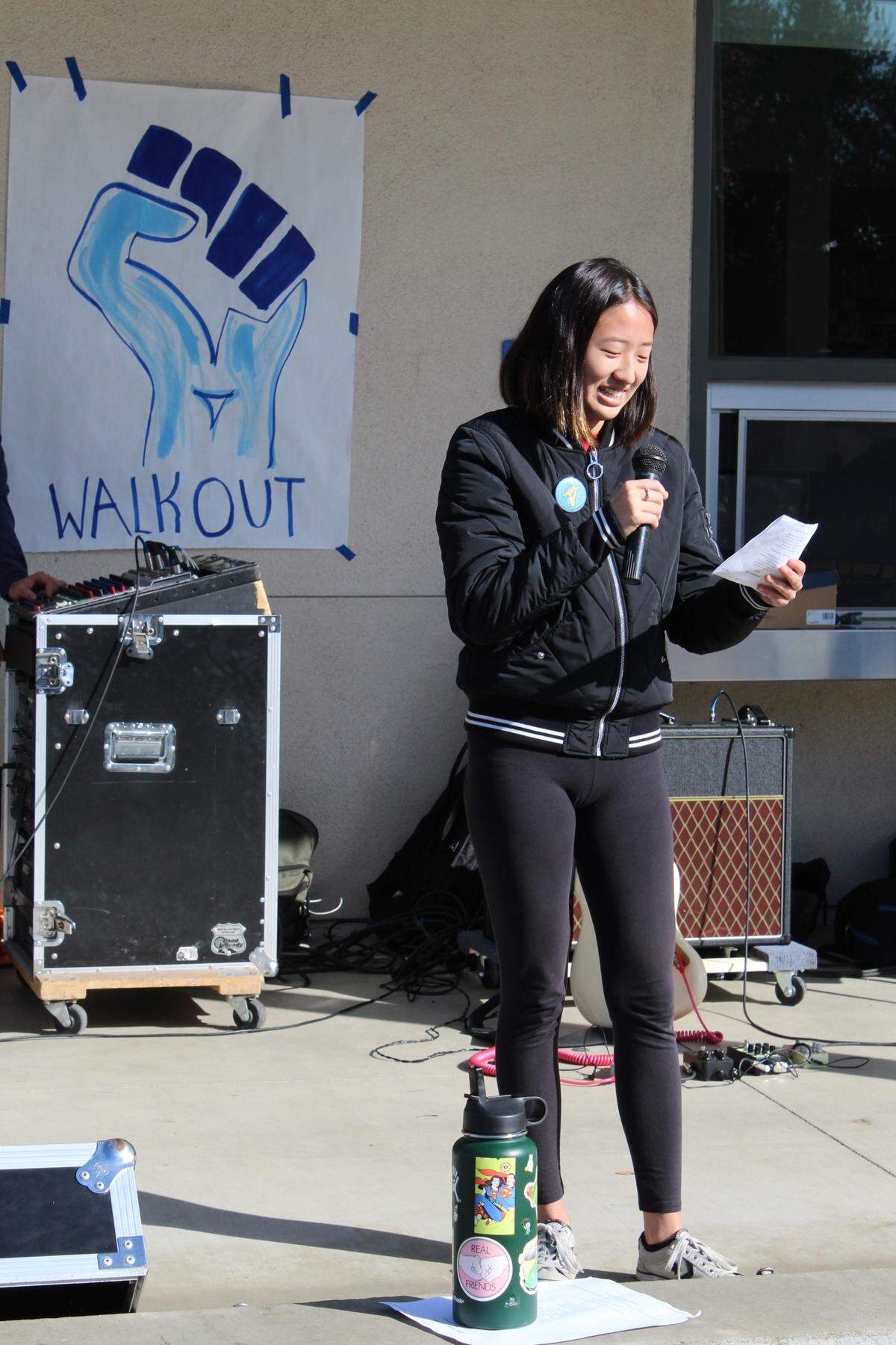 Arroyo Grande High School student Christine Ha sings a rendition of Leonard Cohen's "Hallelujah" during the planned student walkout to protest gun violence on March 14, 2018.