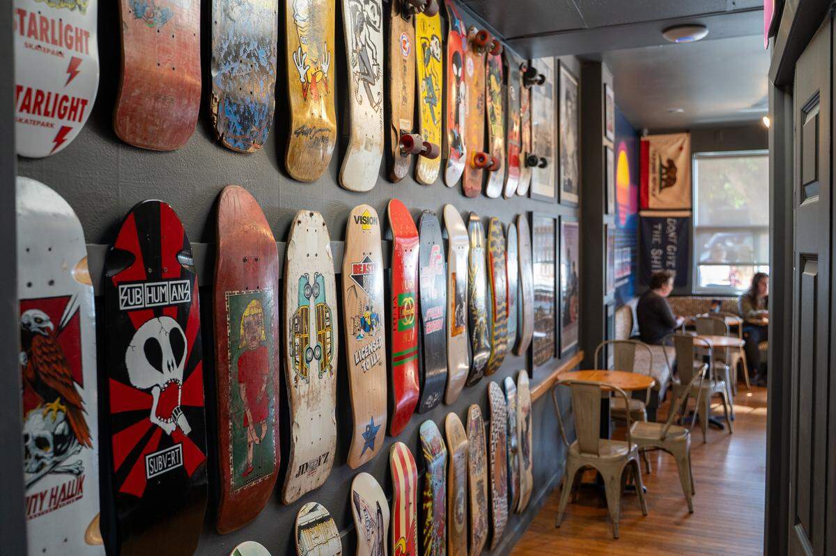 Skateboards and pop culture memorabilia decorate the interior of the new Nautical Bean in Morro Bay on Wednesday, Sept. 3, 2025. Nautical Bean's fifth location in San Luis Obispo County opened in Morro Bay at 911 Main Street on Labor Day weekend.