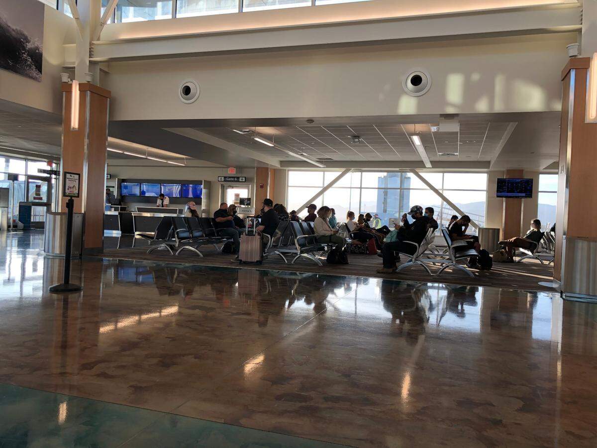 Seats were hard to find at some spaces in the San Luis Obispo County Regional Airport where holiday travelers waited to board their flights.
