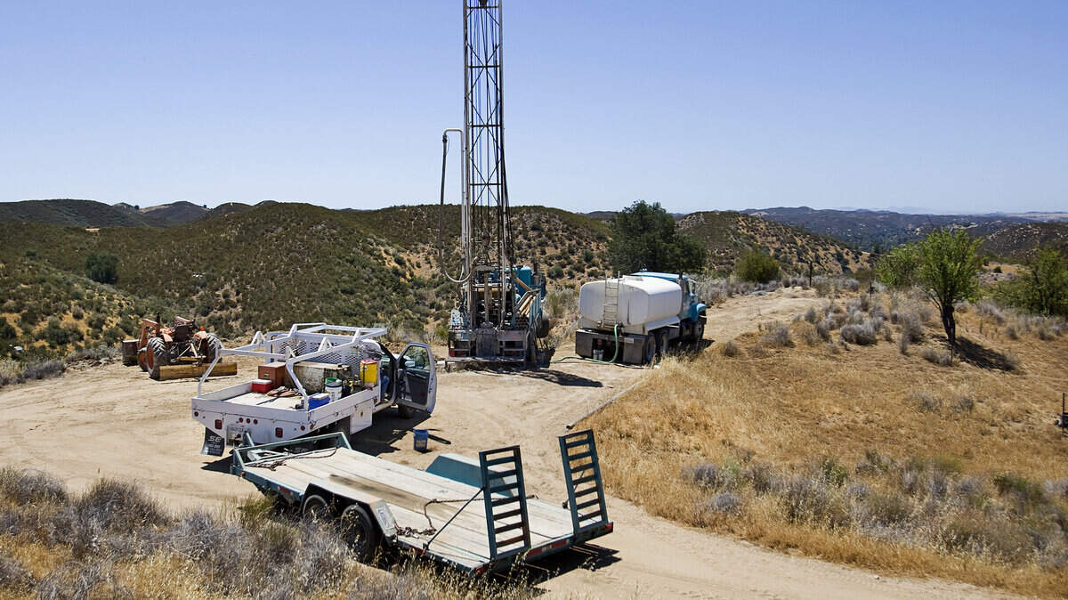 Brian Bullard and Tom Vierra of Miller Drilling Co. in Paso Robles drill a 400-foot well for the Cross family in Creston.