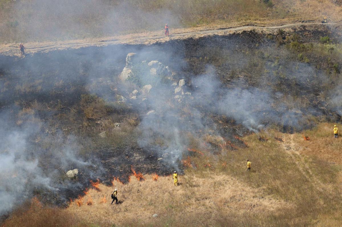The yak titʸu titʸu yak tiłhini Northern Chumash Tribe led a 15-acre cultural burn at the Johnson Ranch Open Space on Tuesday, June 18, 2024.