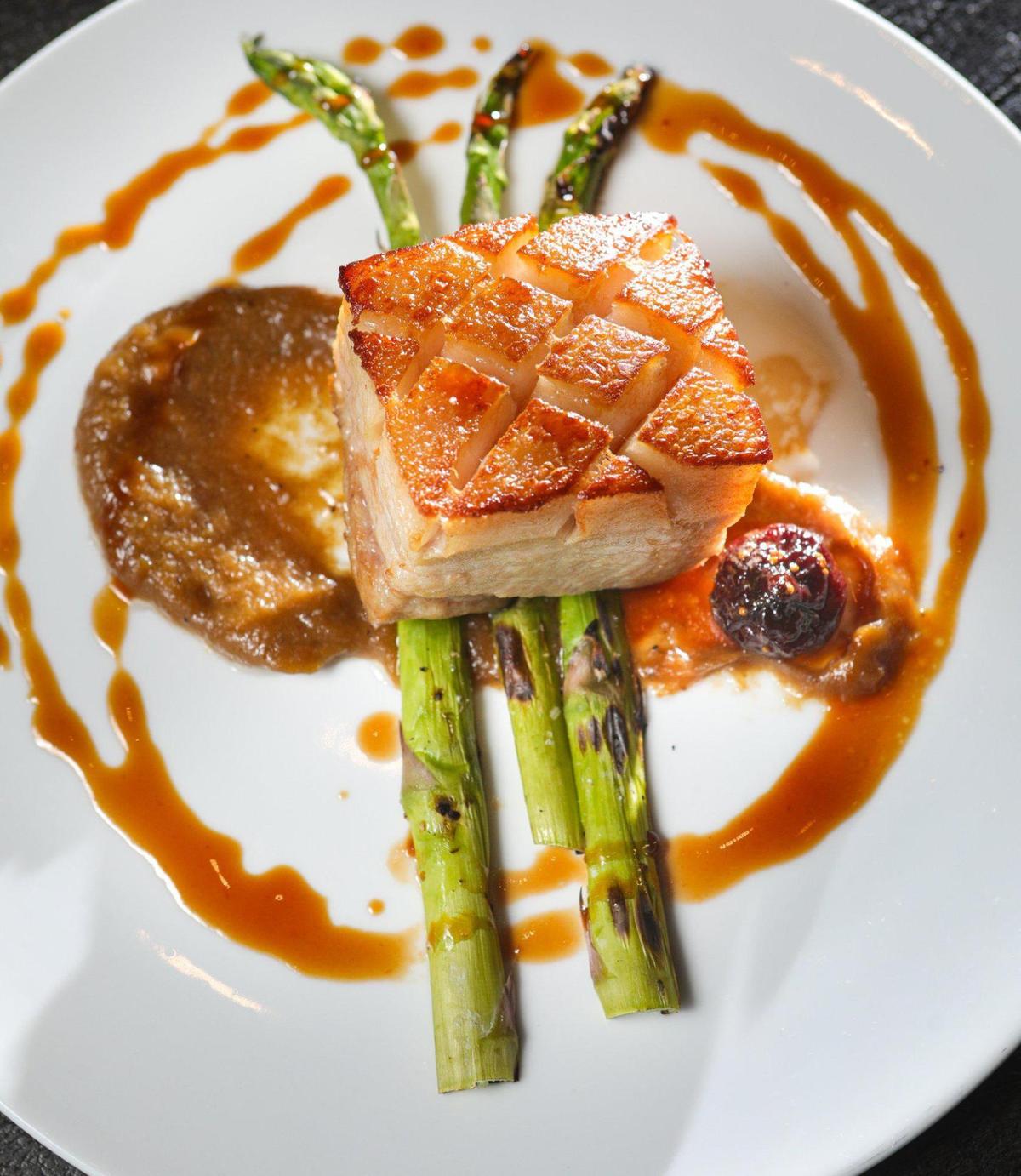 Cielo Ristorante’s Fig & Pork Belly features pork belly confit, port candied figs, confit shallot and asparagus.