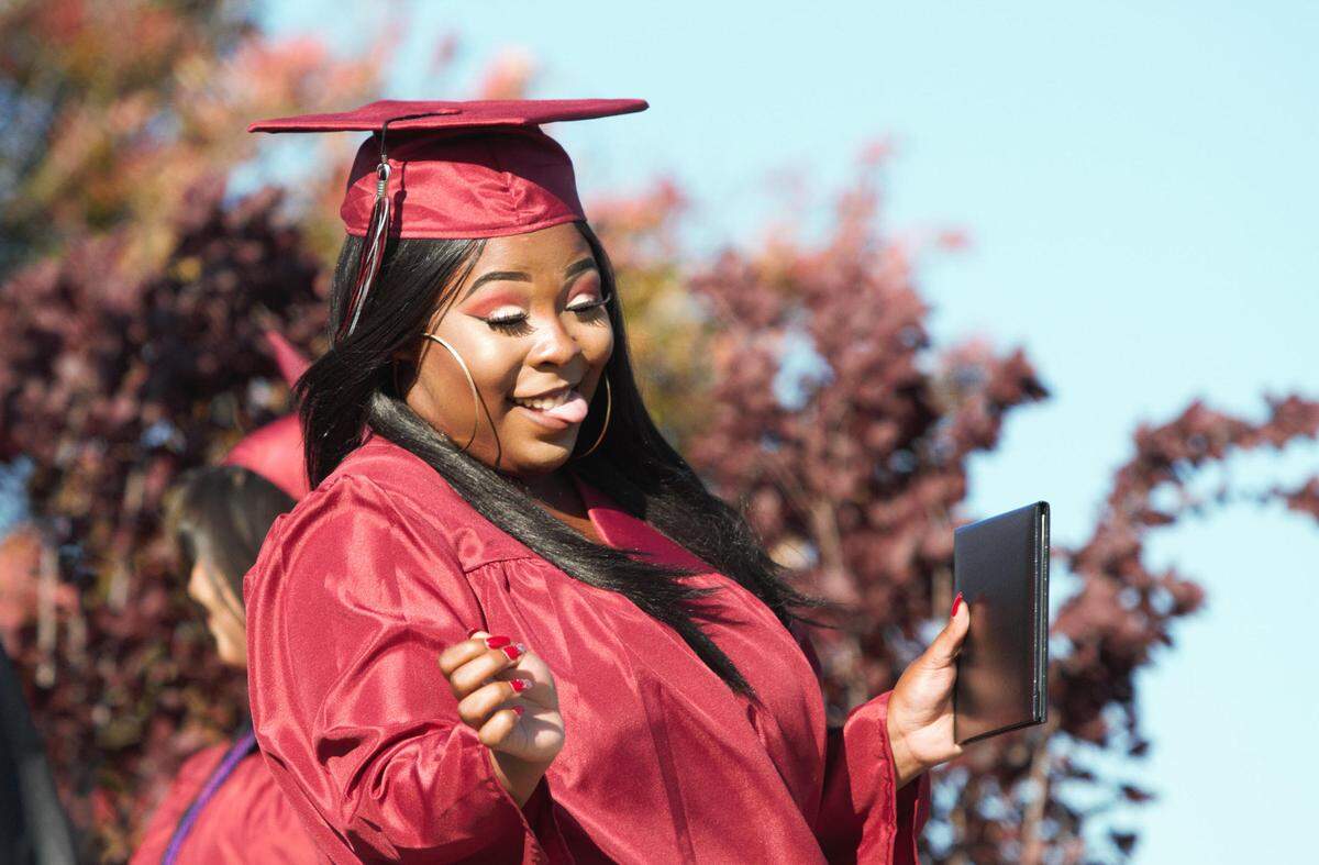 Nipomo High School’s Ebony Anderson celebrates after receiving her diploma at Friday’s ceremony.