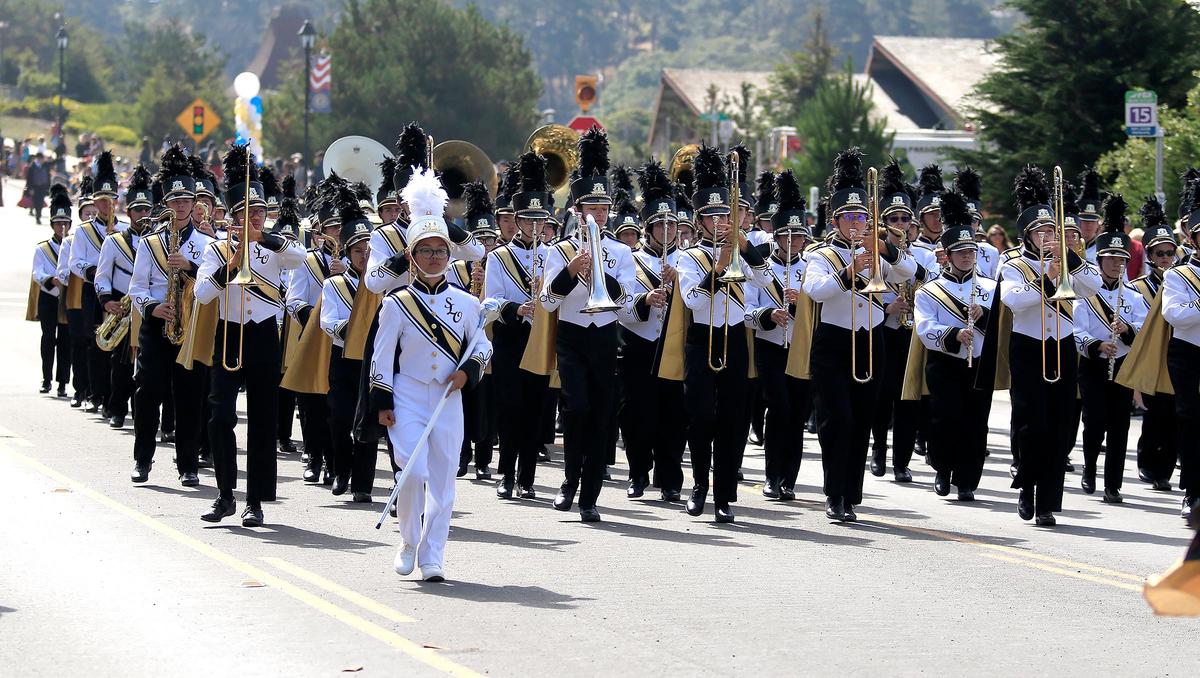 Assistant drum major Francine Pojas, front, leads San Luis Obispo High School Band in Cambria’s Pinedorado Parade in 2019. The 2021 Pinedorado festival was canceled.