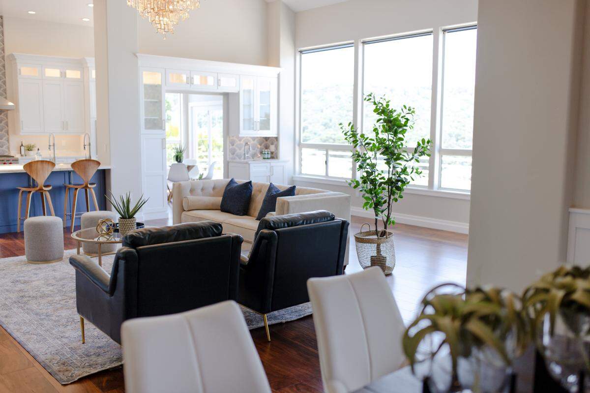 The dining room, living room and kitchen flow together in the remodeled great room of Jovita and Alex Honor’s Arroyo Grande house, creating a space ideal for entertaining.