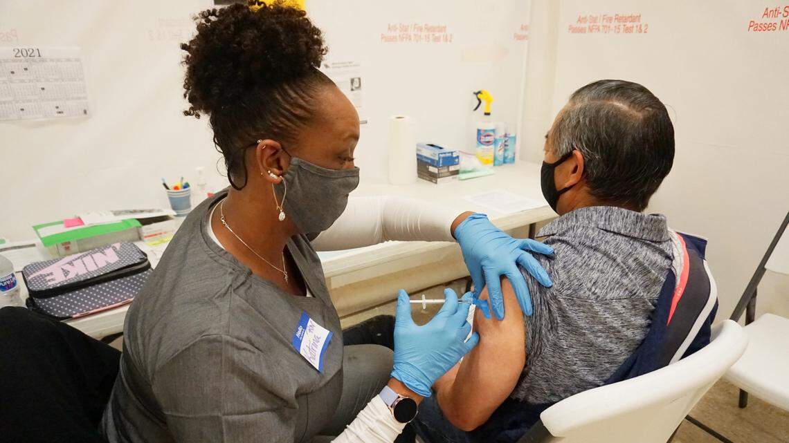 A healthcare worker administers the COVID-19 vaccine to a San Luis Obispo County agriculture worker at a special clinic in Arroyo Grande on Friday, March 19, 2021.