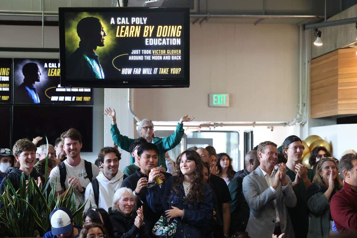 A crowd at Cal Poly cheers for the four Artemis II astronauts, including alum Victor Glover, during a splashdown watch party on Friday, April 10, 2026.