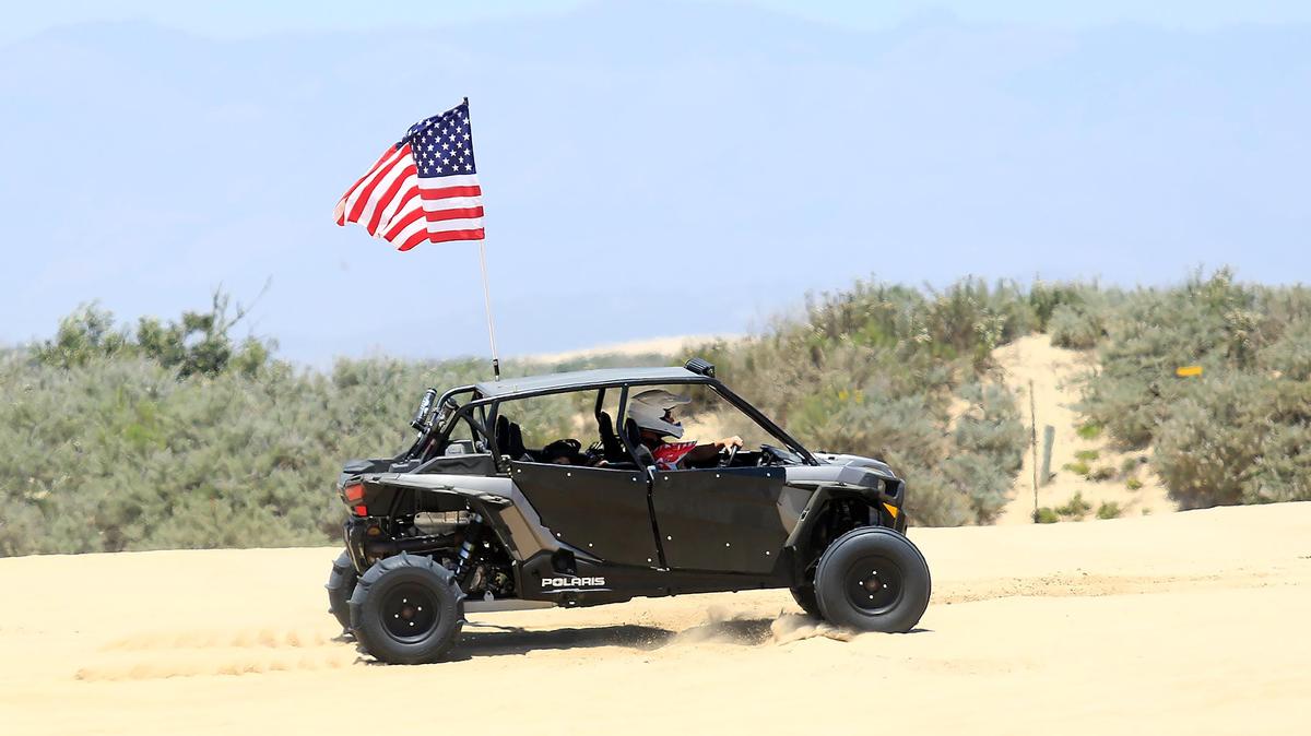 Riders are seen in the off-highway vehicle area of Oceano Dunes State Vehicular Recreation area in June 2019. The California Coastal Commission will discuss OHV use at the Oceano Dunes at its meeting on Thursday, March 18, 2021.