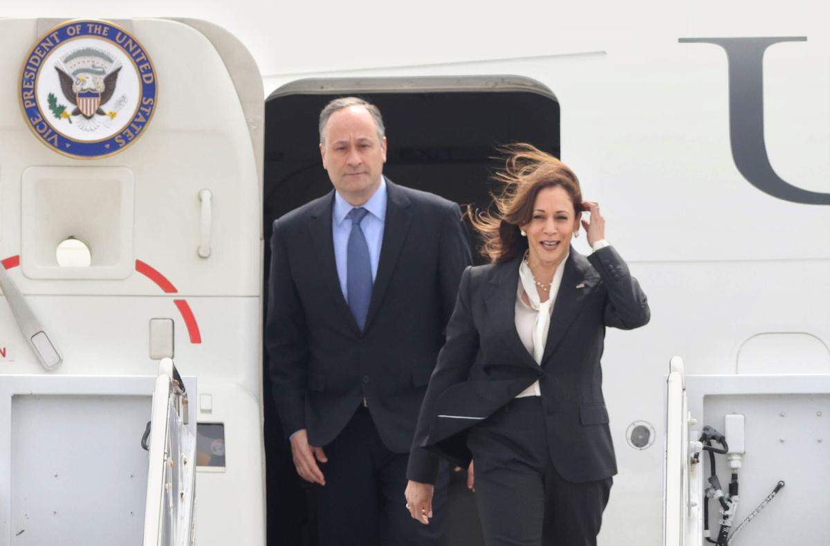 Vice President Kamala Harris and her husband Doug Emhoff disembark Air Force 2 after arriving at Vandenberg Space Force Base.