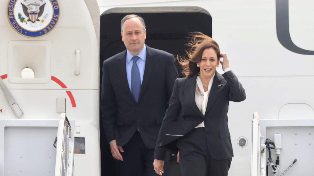 Vice President Kamala Harris and her husband Doug Emhoff disembark Air Force 2 after arriving at Vandenberg Space Force Base on Monday, April 18, 2022.