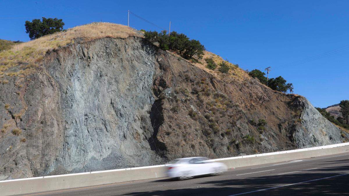 The right lane of southbound Highway 101 is closed for one mile near Old Stage Coach at the bottom of the Cuesta Grade as Caltrans works on a rockfall fence project on July 9, 2024.