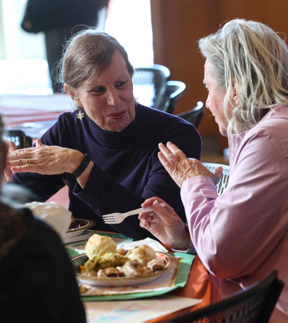 Tamme Jacobson, left, and Denise Frost talk during their meal. The 41st annual Thanksgiving dinner was hosted by the Pismo Beach Police Officers’ Association on Nov. 27 2024. Over 2,500 dinners were prepared and 60 turkeys were cooked for the meal.