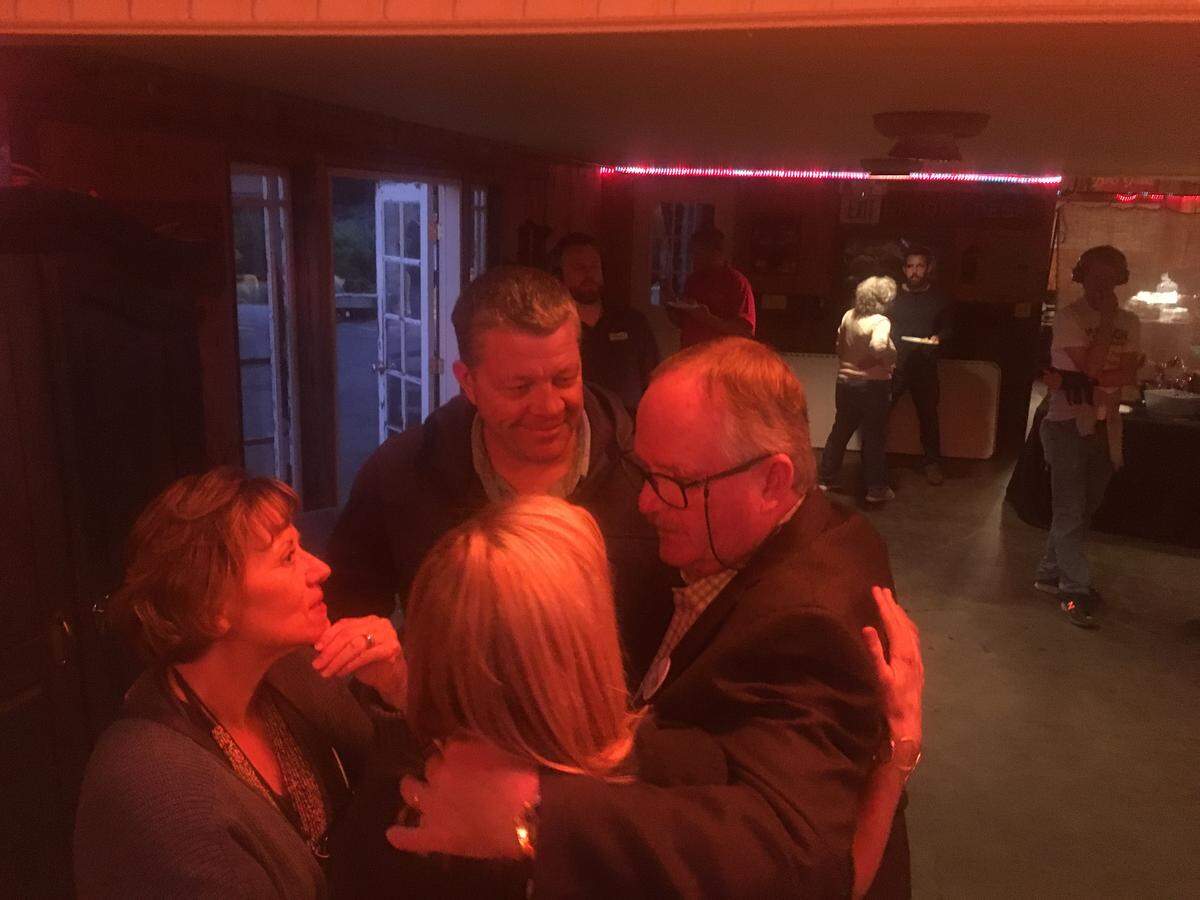 Greg Clayton embraces supporters at the Holland Ranch in Edna Valley on election night June 5, 2018.