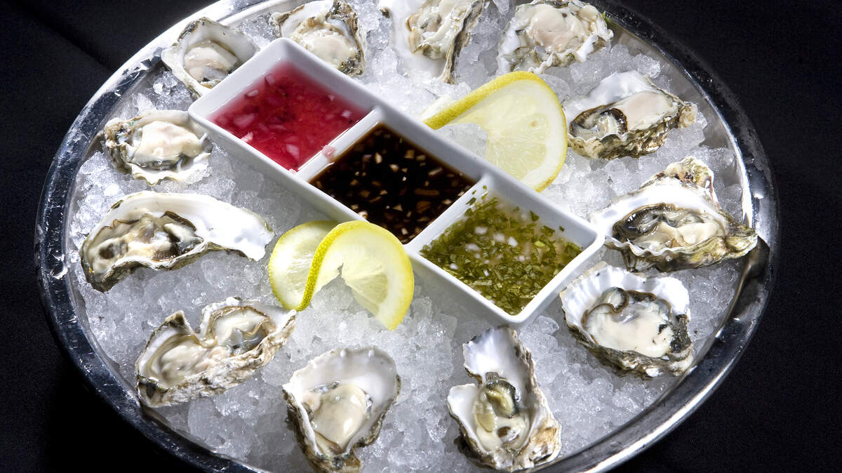 At Ciopinot, oysters on the half shell are served with three dipping sauces.