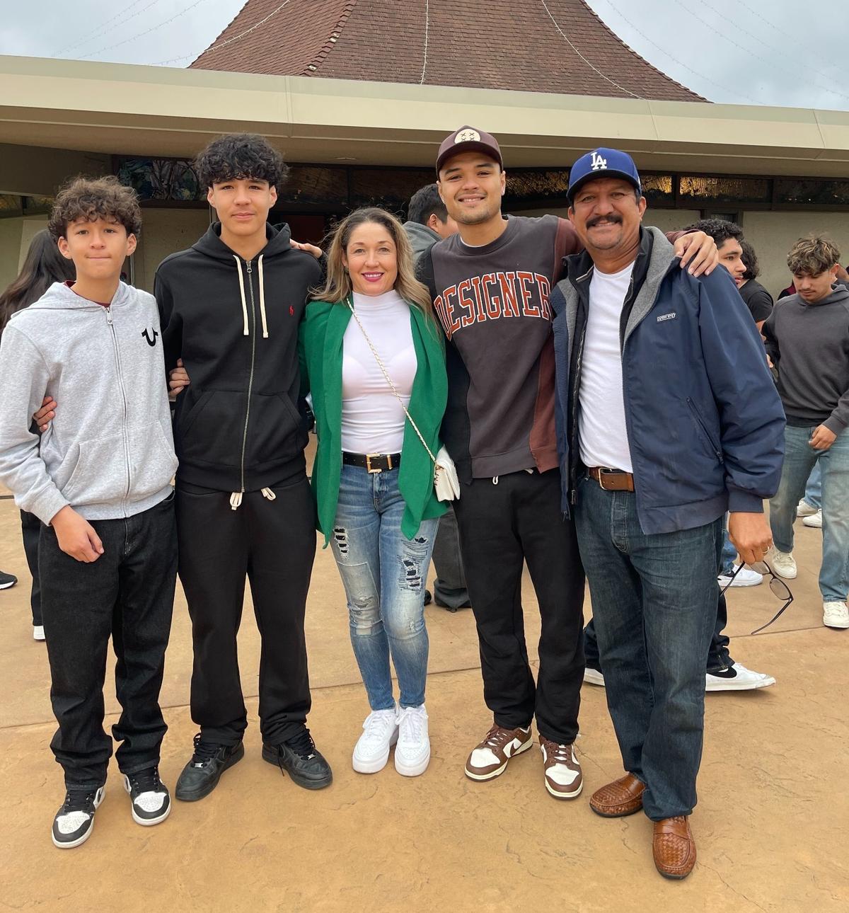 The Aguilar family poses together at the Santa Rosa Catholic Church in Cambria this June, a few months before the middle son’s death. From left to right: Eric’s youngest brother Kevin, Eric, his mother Flor Patricia Miranda, his older brother Chava and his father Salvador.