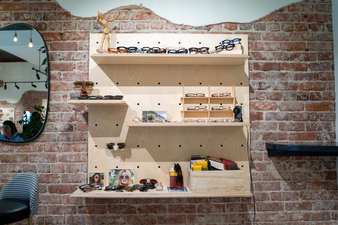 Pairs of glasses on display at Specs by Kyla on Tuesday, April 14, 2026. The boutique moved into a new space at 5915 El Camino Real, and exposed the brick in the historic building.