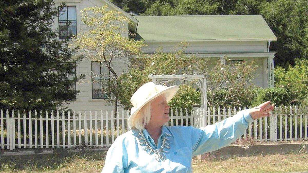Dawn Dunlap regales a group about Cambriaâ™s oldest home, the Music House on Main Street, during a tour in 2009.