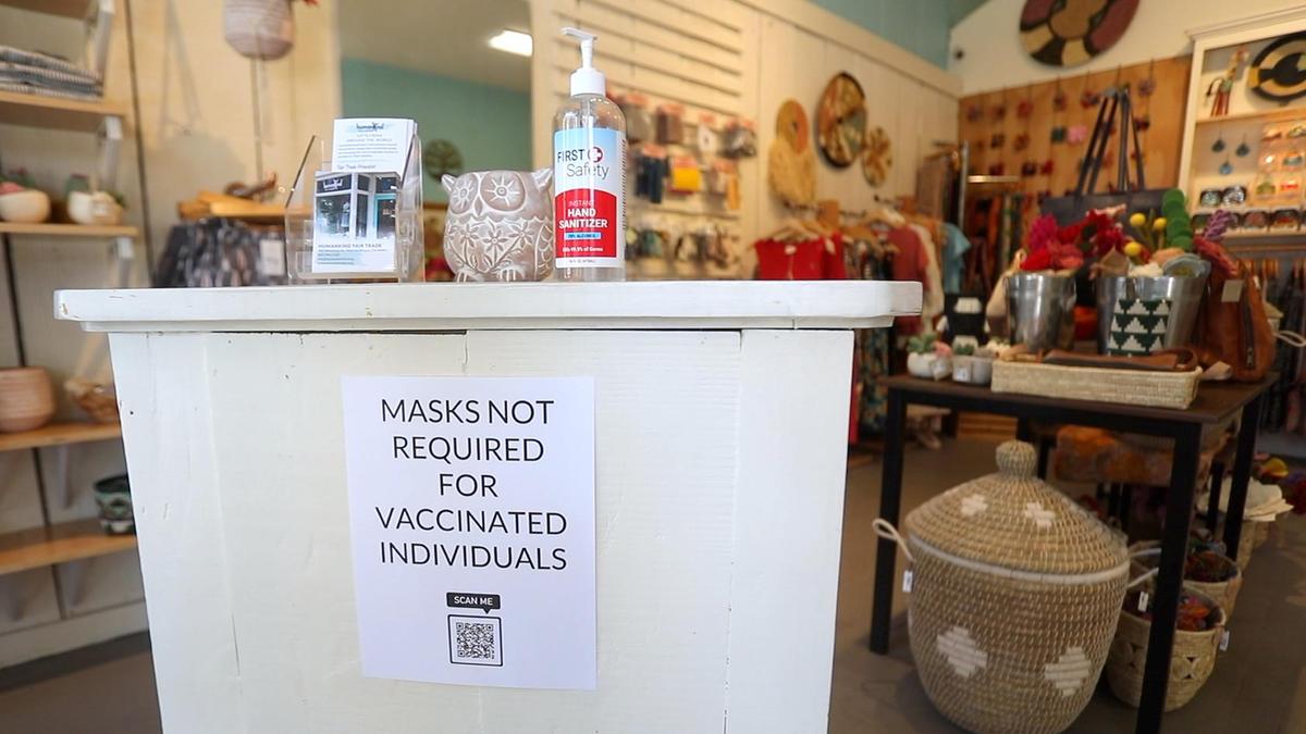 HumanKind Fair Trade no longer requires vaccinated customers to wear masks, but manager LynAnne Wiest said staff will continue to use them.