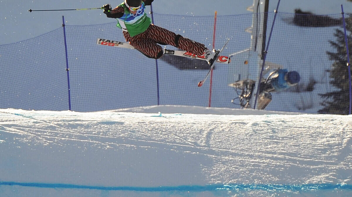 Christopher Delbosco from Canada twists in the air on his way to crashing during the final in the men's ski cross. (Jason Payne / Canwest News Service / MCT)