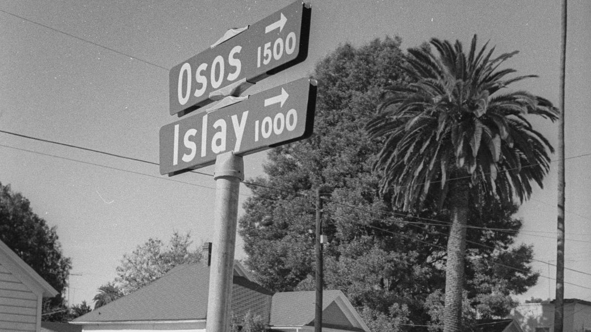 This photo from Dec. 1, 1971, shows an incorrectly installed street sign at the corner of Osos and Islay streets. This was the brown-and-white sign with the Series E font that was prior to the current calligraphic signs.