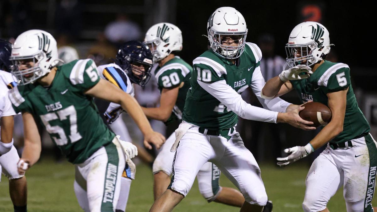 Colter Tannehill hands off to Braden Mott, Anthony Huseby blocks at left. Monache beat Templeton 20-17 on Aug. 30, 2024.