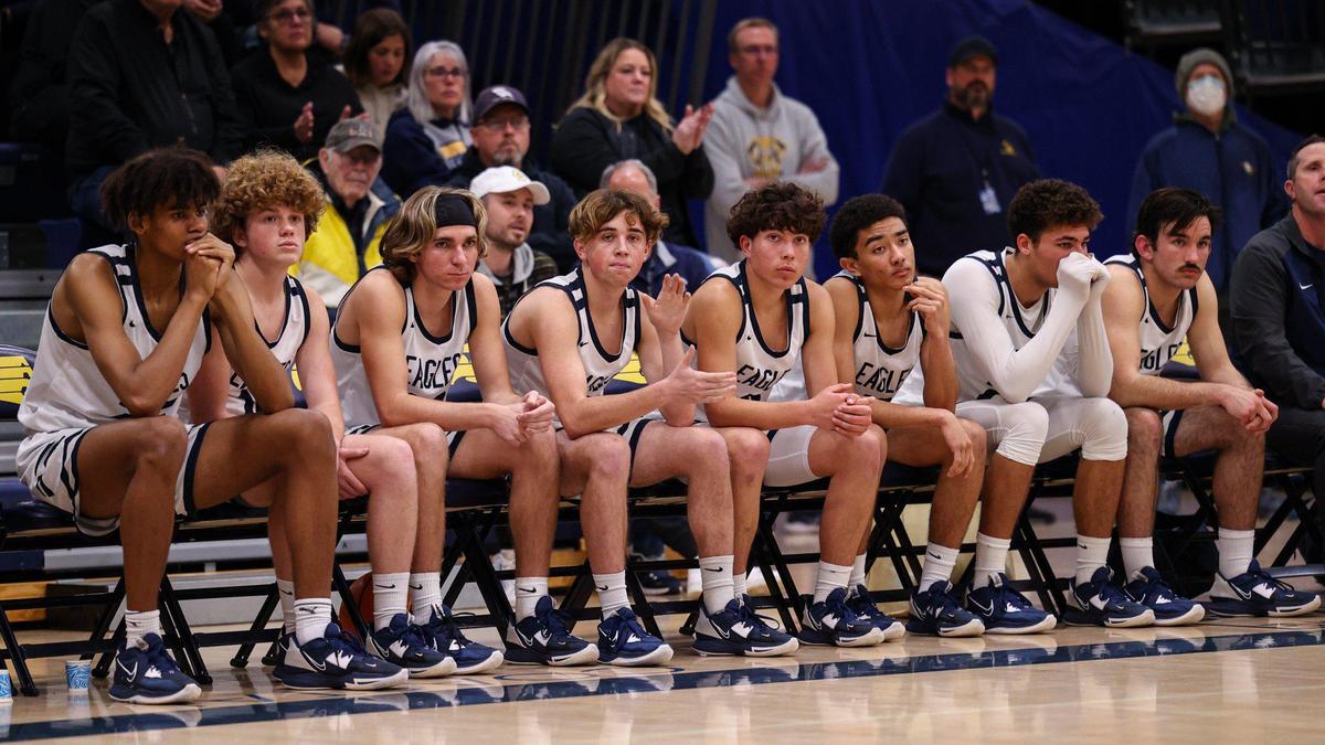 The Eagles players watch from the bench as Arroyo Grande fell 76-62 to Blair in the first round of 2023 Division 4 CIF State Boys Basketball Championships on Feb. 28, 2023.