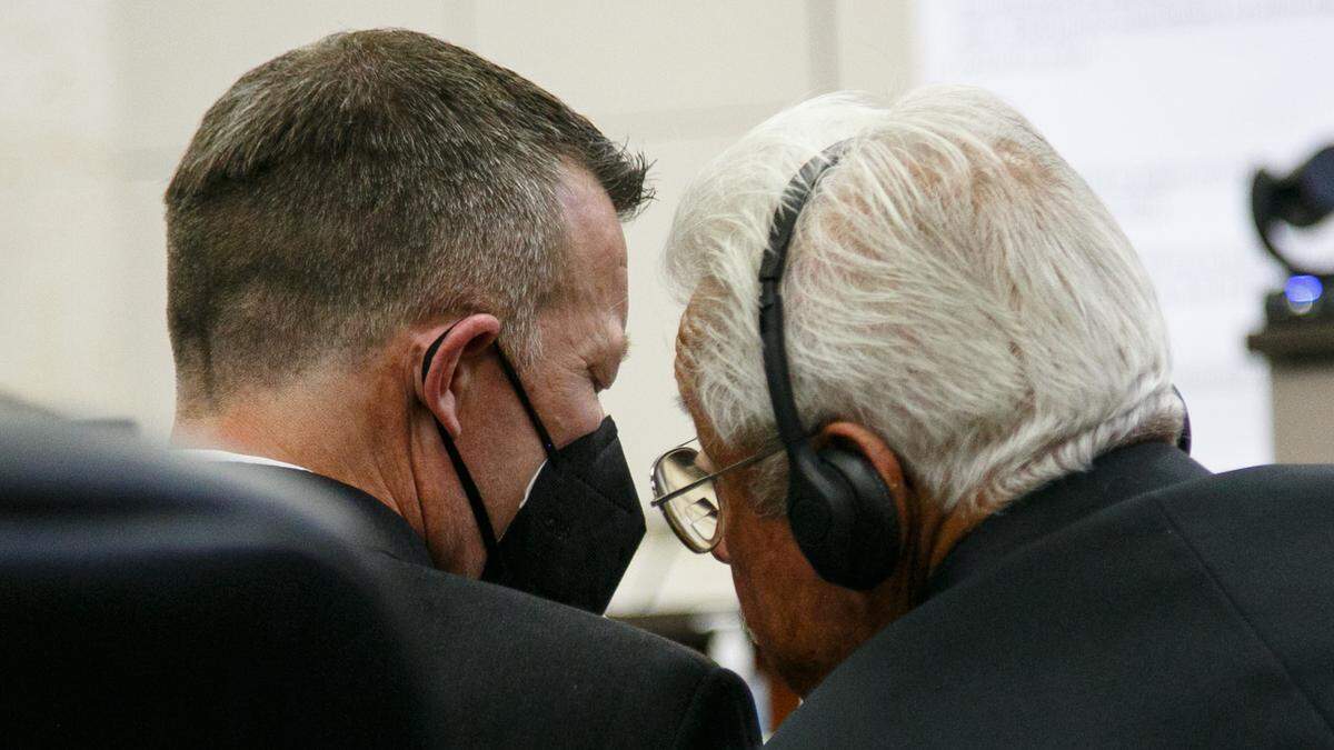Paul and Ruben Flores confer in Monterey County Superior Court in Salinas on Tuesday, Aug. 30, 2022, during the Kristin Smart murder trial.