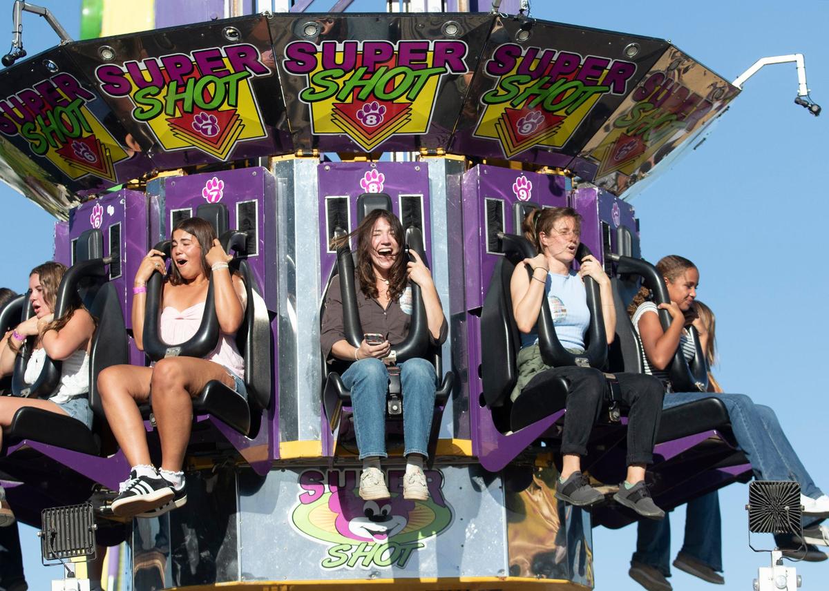 Tribune reporters Chloe Shrager, left, and Kelsey Oliver take on this year’s rides, games and food at the 2024 Mid-State Fair. The Paso Robles fair opened Wednesday, July 17, 2024. Shrager and Oliver scream on the Super Shot ride.
