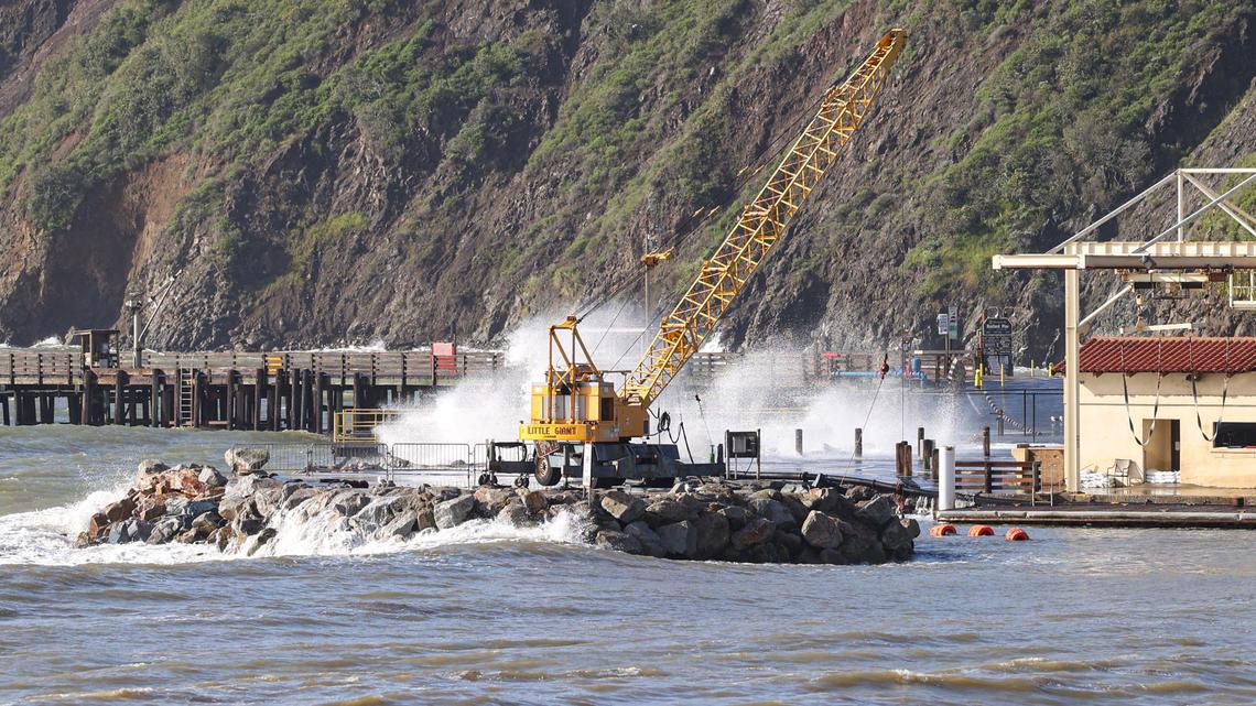 Wind-driven waves crash at south-facing Port San Luis during a break in the clouds on March 21, 2023.