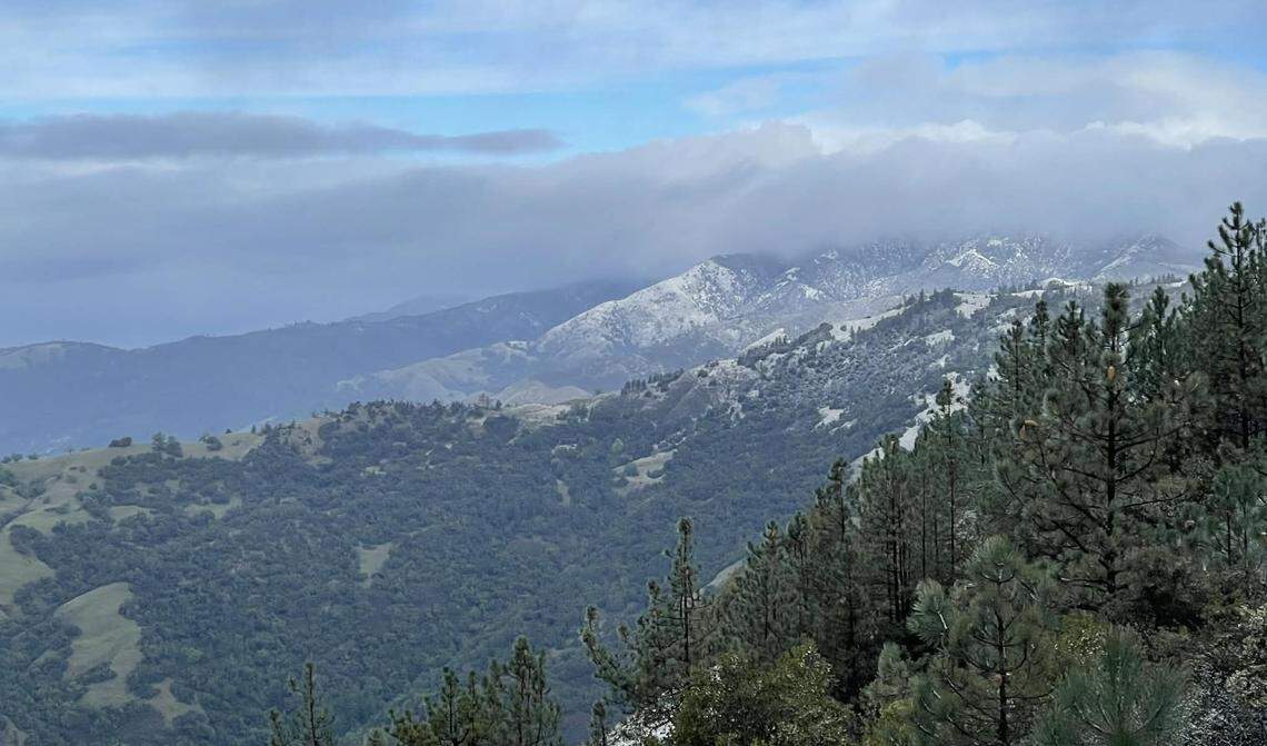 Snow dusts the hills along the Big Sur coast on Wednesday, Feb. 18, 2026.