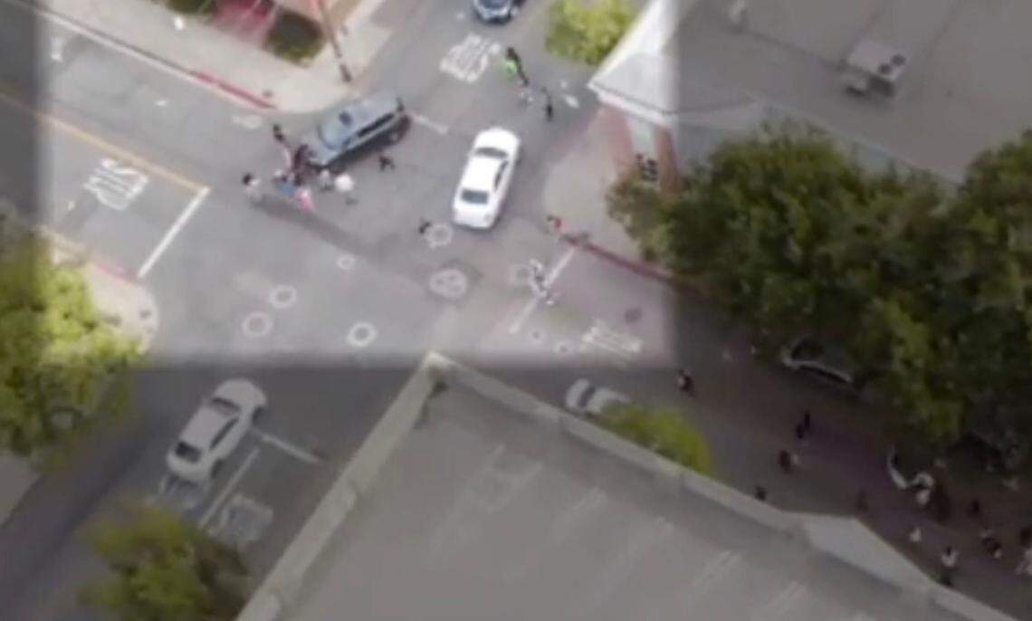 A screenshot of a drone video provided by the San Luis Obispo Police Department shows a confrontation between protesters and a gray car at the corner of Chorro and Pacific streets during the July 21 march. The driver pushed through the protesters because he was fearful of the “mob mentality,” police said.