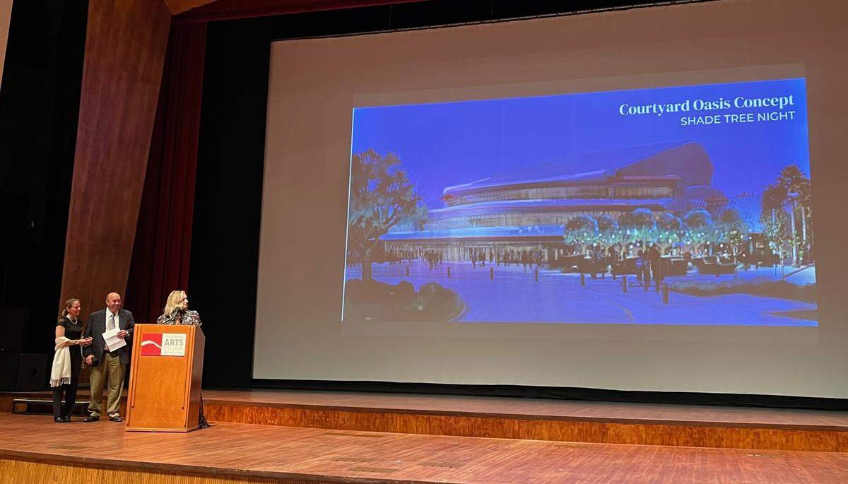 Kristin Hoover, interim executive director of the Foundation for the Performing Arts Center, announces a $1 million donation from Ty and Trudie Safreno, left, that will fund an upgrade to the PAC’s plaza, complete with tables, seating, trees and colorful lights. Hoover made the announcement at the premiere of the PAC documentary “Playing in Unison” on Saturday, April 23, 2022.