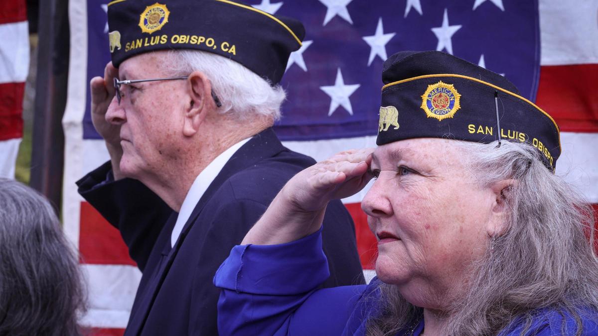 Veterans David Glidden and Nora O’Donnell salute as the National Anthem is played. Over 150 people attended the Veterans Day celebration at the San Luis Obispo Veterans Memorial Building on Nov. 11, 2024.