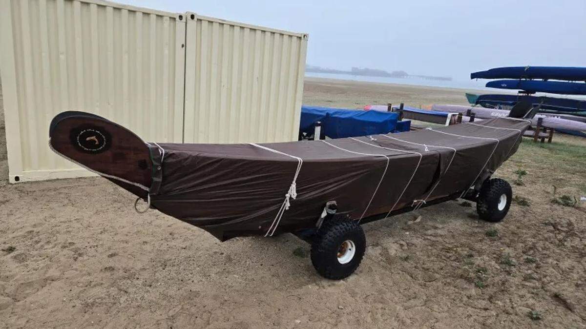 A 25-foot-long and 700-pound wooden Chumash tomol that has gone missing in Santa Barbara usually sits on West Beach near the outriggers.