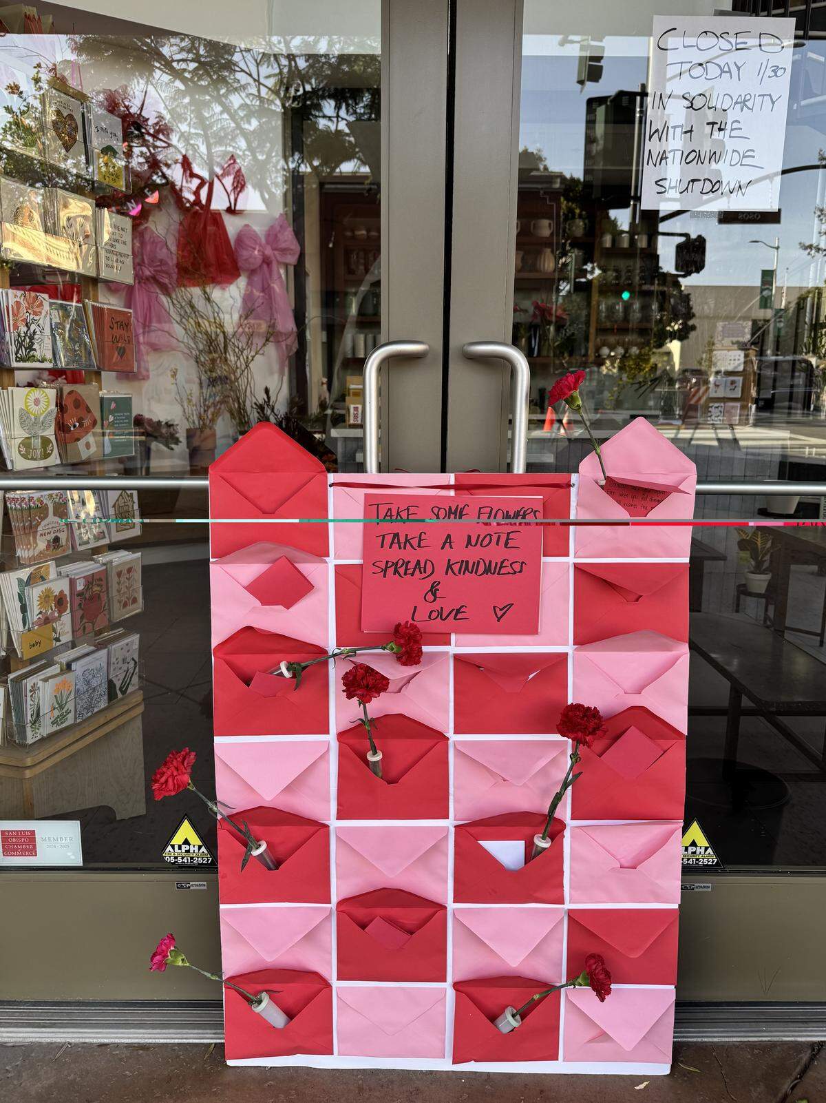 Open Air Flowers in San Luis Obispo was closed Friday, Jan. 30, 2026, in solidarity with the nationwide strike. The shop offered free carnations and notes to “spread kindness and love.”