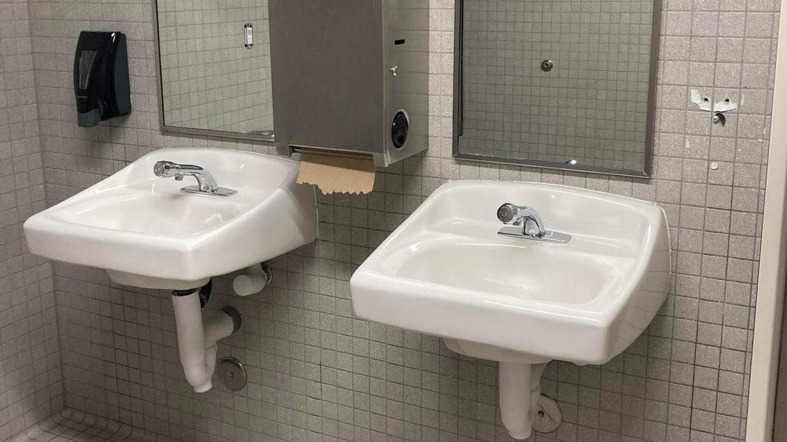 A hand soap dispenser, right, was stolen from a bathroom at San Luis Obispo High School, likely as part of the “devious lick” TikTok trend in which students steal school property or commit acts of vandalism on campus.
