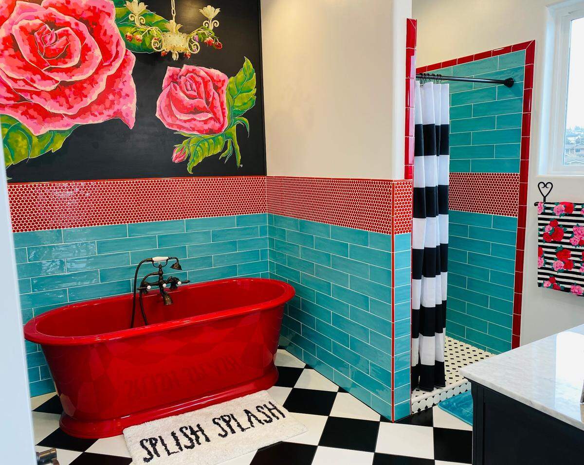 In the master bathroom of Barb and Jeri Saia’s Los Osos home, traditional tile styles such as hexagon, harlequin and subway take on new life with bold red and turquoise.&nbsp;