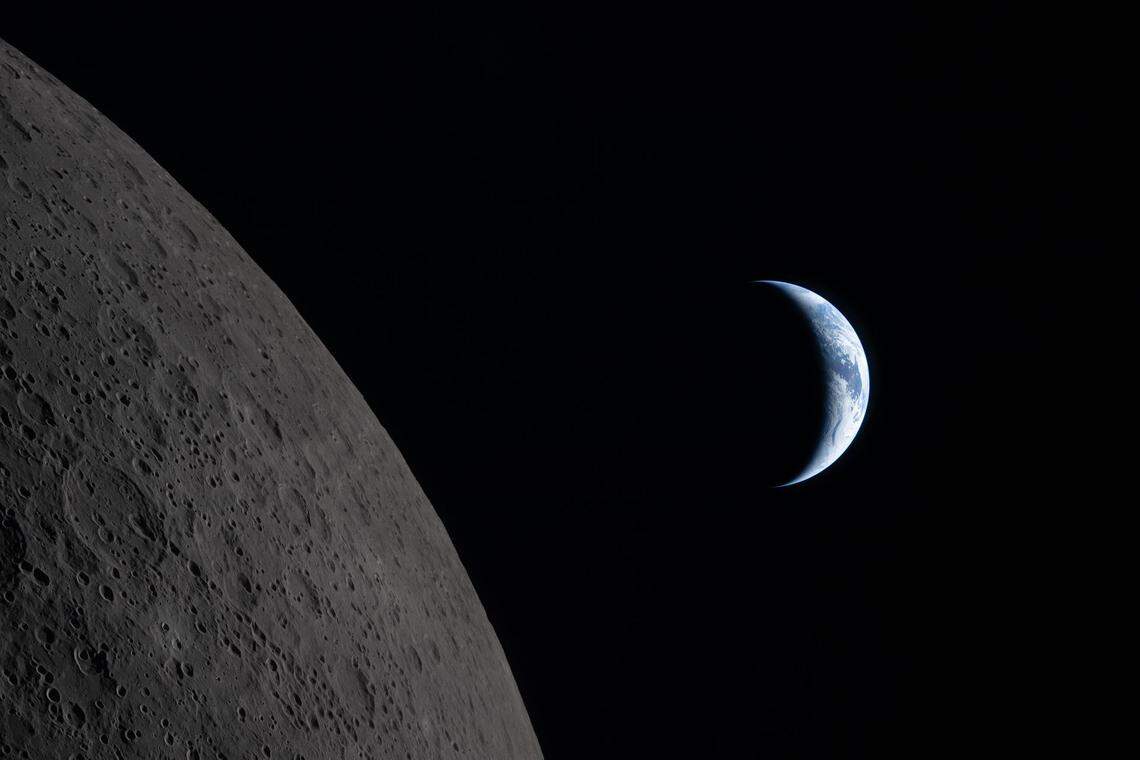 Earth draws closer to passing behind the moon in this image captured by the Artemis II crew during their lunar flyby on April 6, 2026, about six minutes before Earthset.
