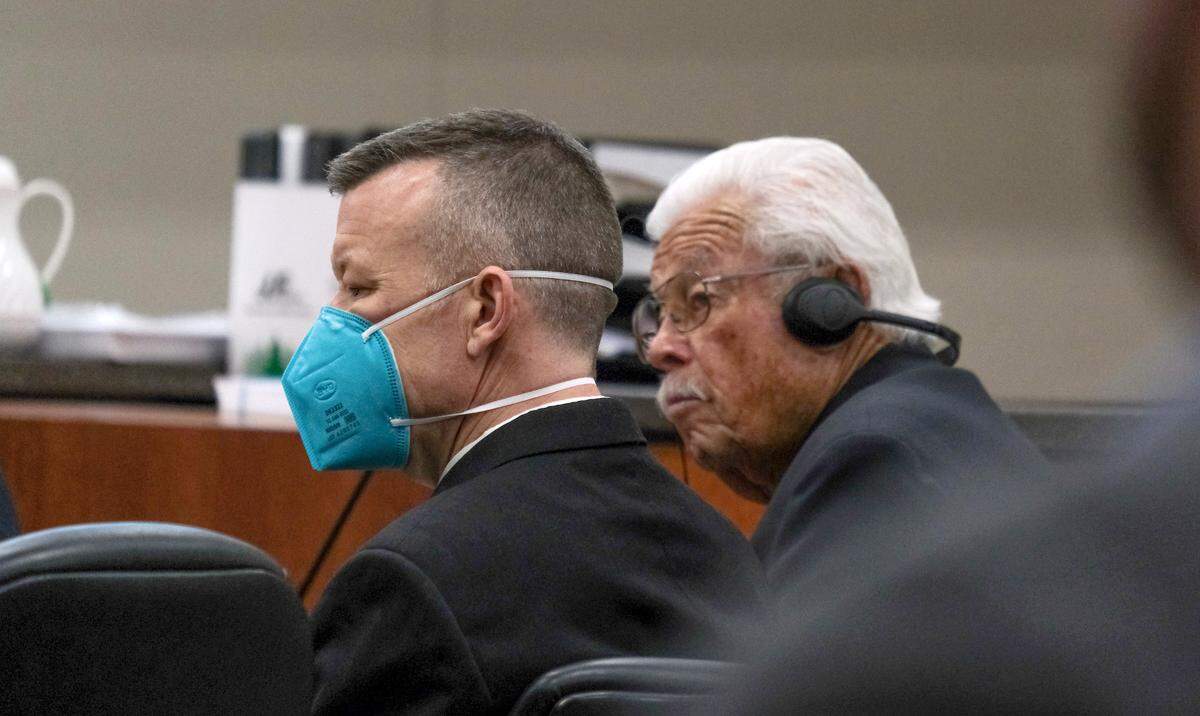 Paul Flores, left, and his father Ruben Flores listen during day two of pretrial motion hearings in the Kristin Smart murder case in the Monterey County Superior Court in Salinas on June 7, 2022.