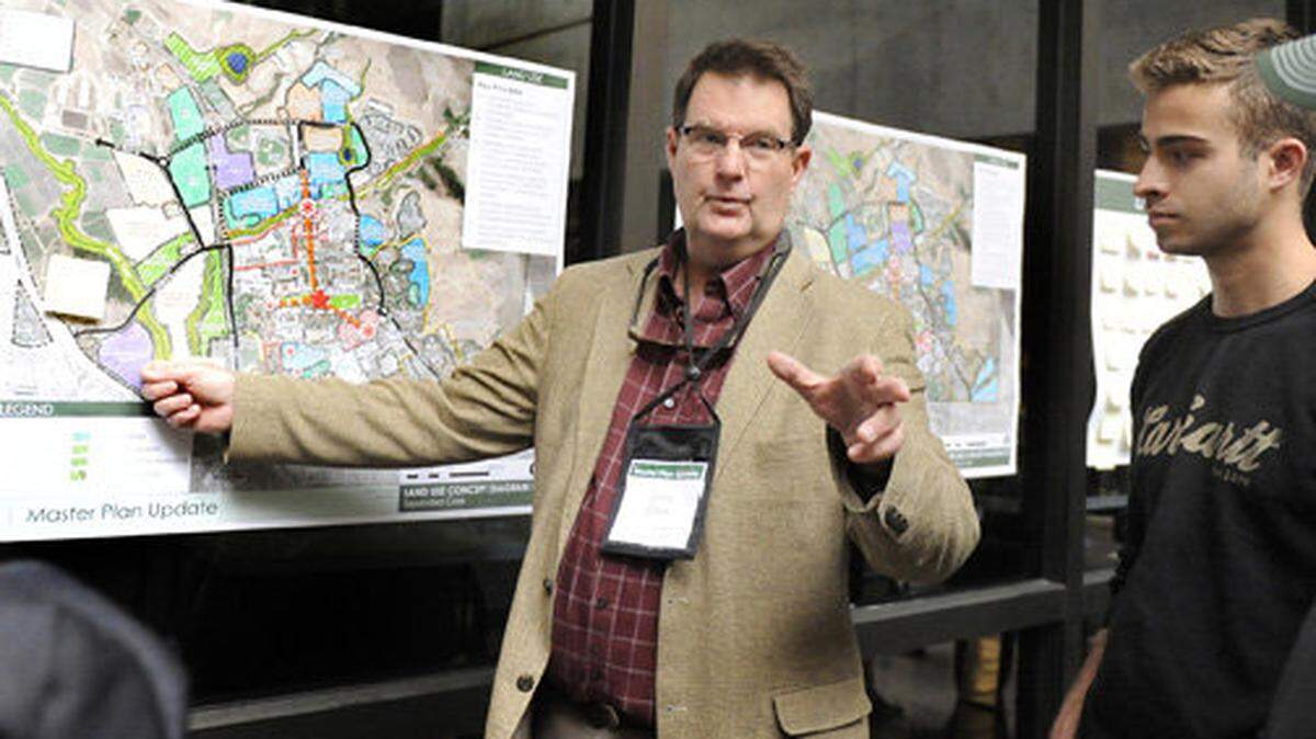 Chris Clark, a member of the Cal Poly Master Plan Professional Team, answers questions during an open house at the Kennedy Library on Thursday, May 7, 2015.