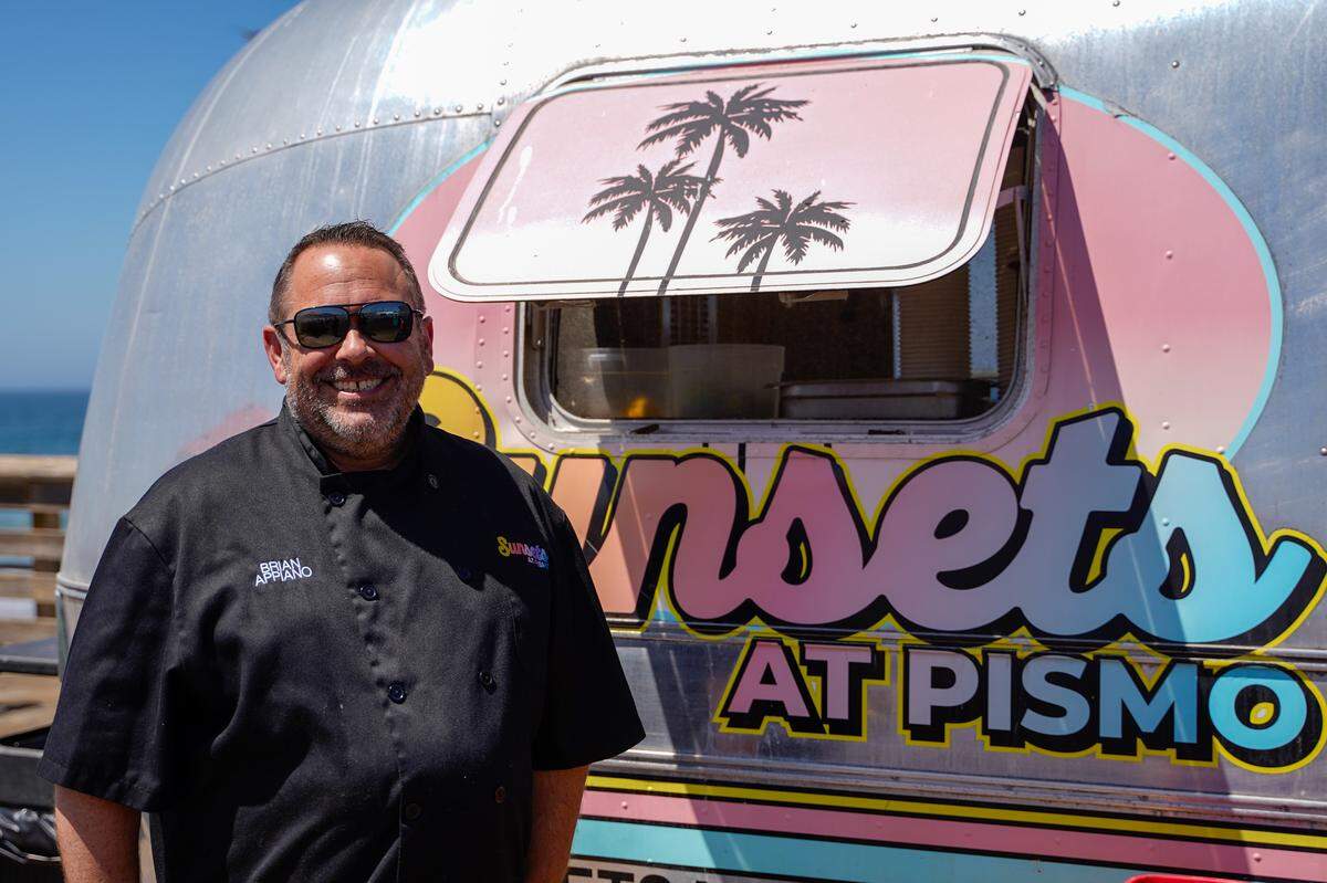 Brian Appiano, owner of Sunsets at Pismo, The Switch and the Rib Line, stands outside the Airstream trailer that's been home to Sunsets at Pismo for five years on Wednesday, Aug. 27, 2025. Sunsets at Pismo will close permanently at the end of October due to a zoning error by the city of Pismo Beach.